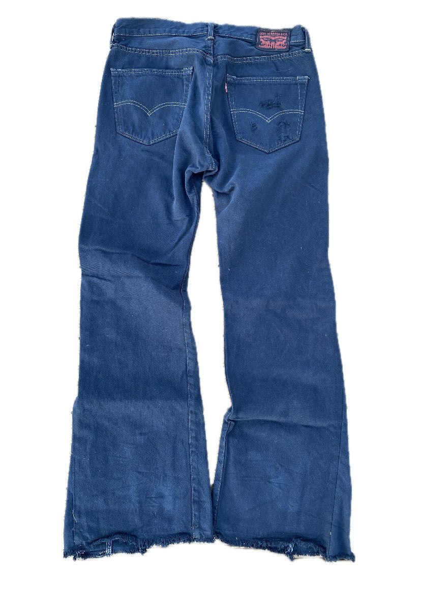 Dyed and distressed flared denim